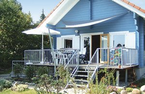  Træhus med komfortabel indretning i skandinavisk stil og udsigt over Schwarzer See. Nabohuset er DMV255. Barnseng og -stol kan lejes. Ikke-rygerhus. ...